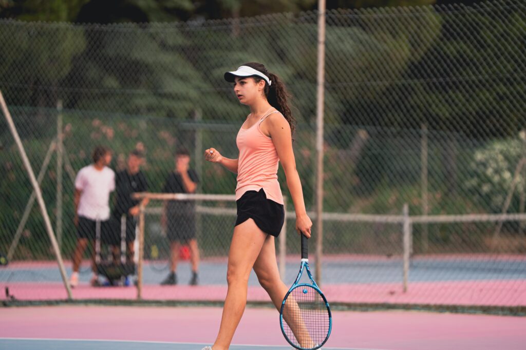 A player clenching her fist after winning a point during the Tennis Showcase 2026 in Cap d'Agde.