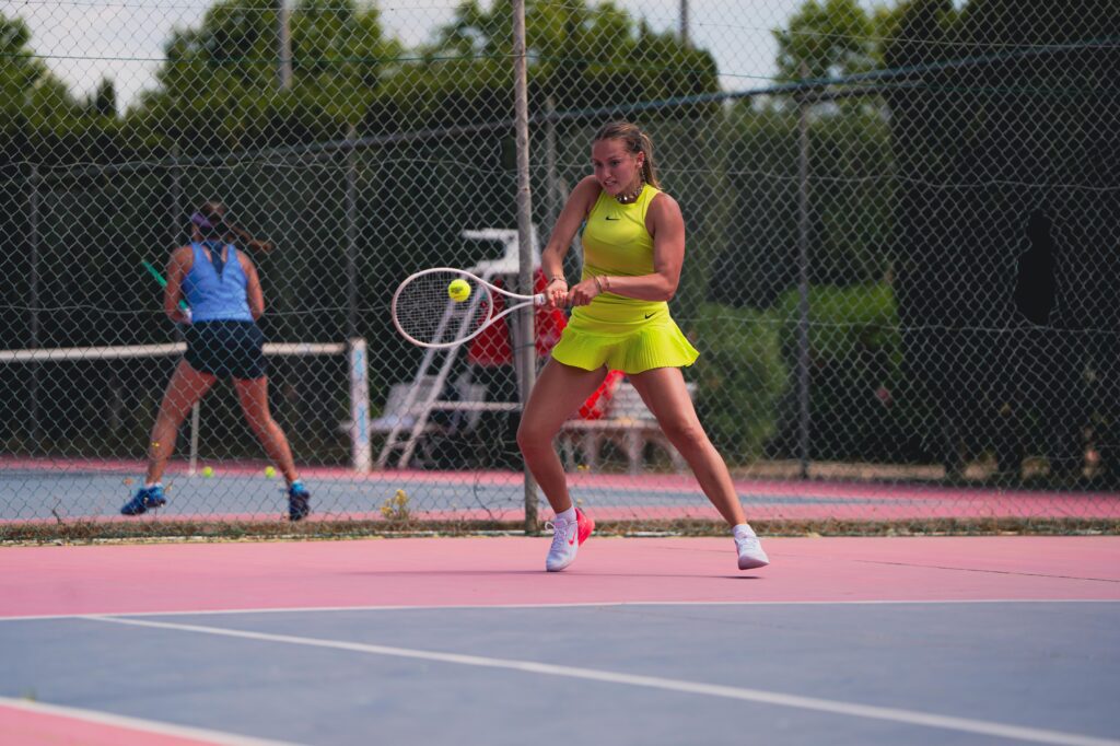 Yelena Lebeau hitting a two-handed backhand during the Tennis Showcase 2026 in Cap d'Agde.