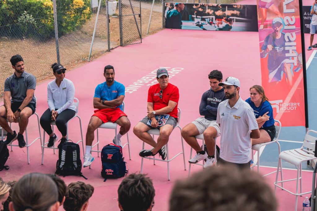 Participants talking with American university coaches during a group session at the Tennis Showcase 2026.