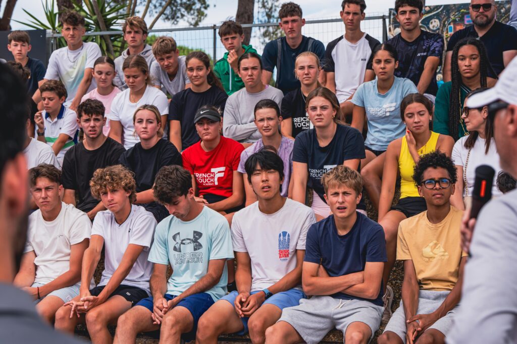 Tennis Showcase 2026 players listening to American university coaches during a discussion session in Cap d'Agde.