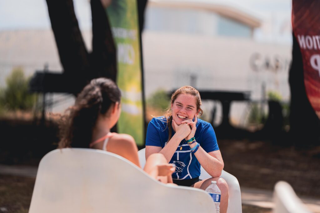 A player talking with an American university coach during the Tennis Showcase 2026 in Cap d'Agde.