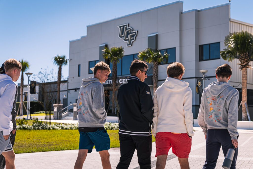 Young ProcessUS tennis camp players in front of the University of Central Florida sports building during the campus tour
