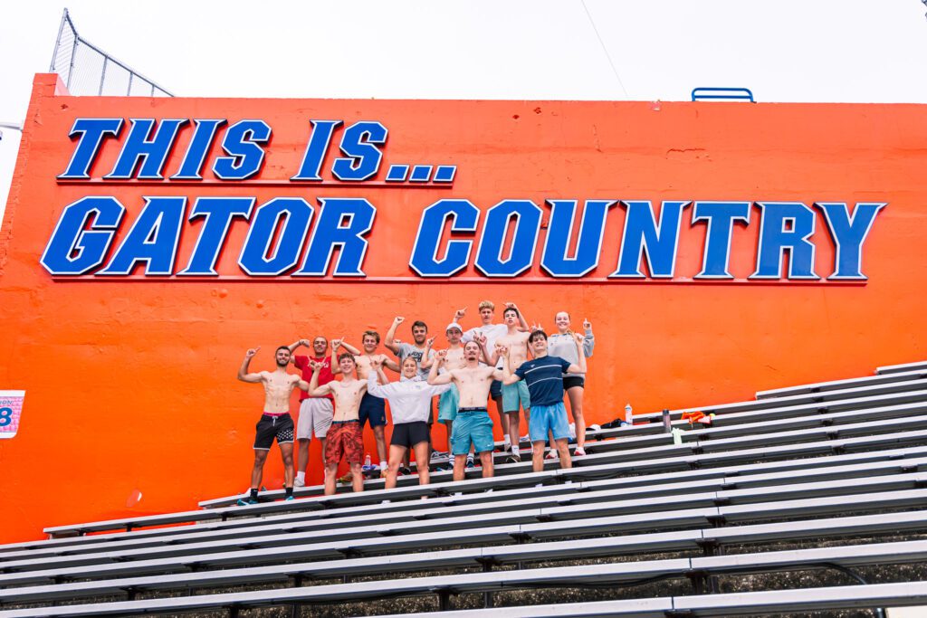 Group of young players in front of the Gator Country sign at the University of Florida