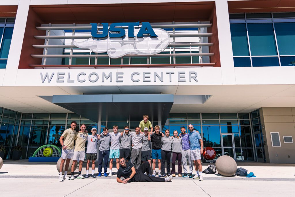 Florida Tennis Roadtrip participants in front of the USTA National Campus