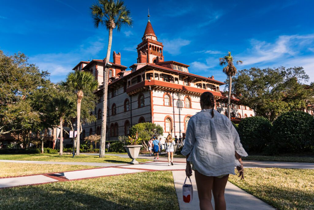 Group of visitors in front of the historic Flagler College building in Saint Augustine